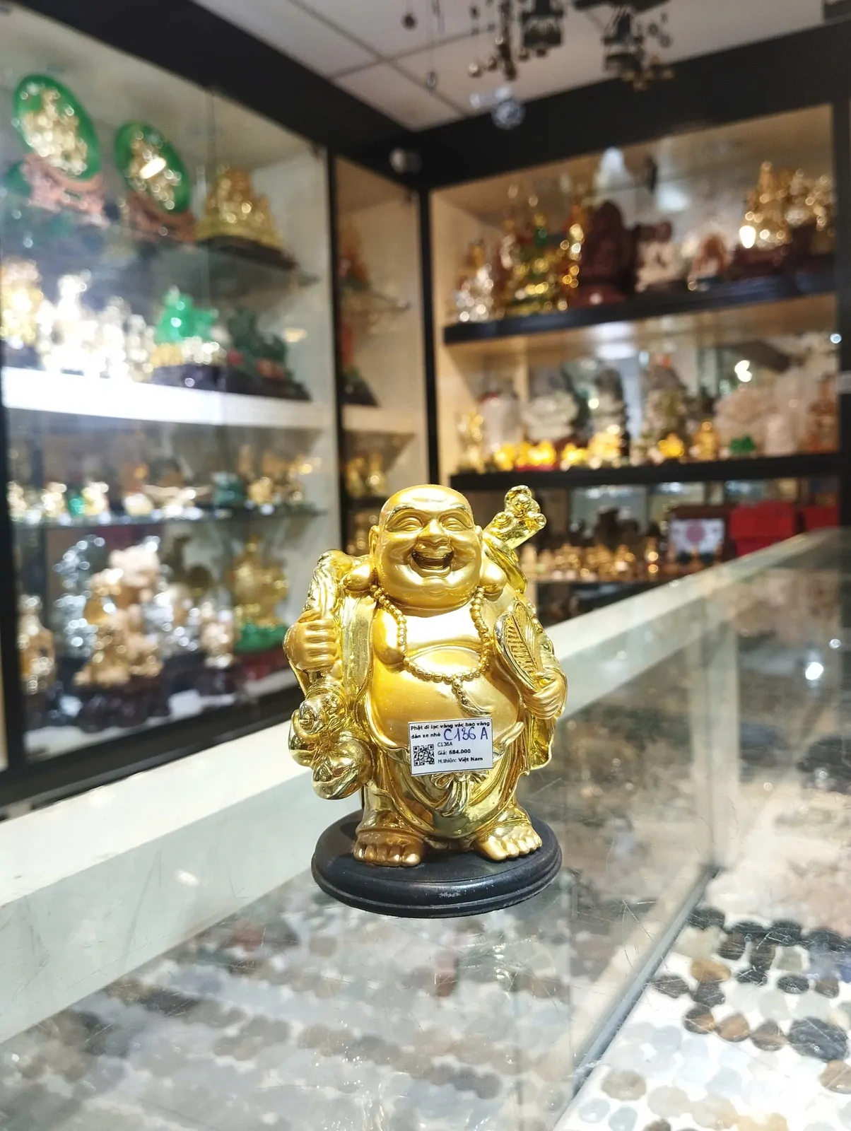 Phật di lạc vàng vác bao vàng dán xe nhỏ C136A